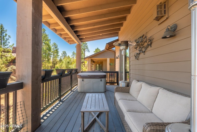 wooden terrace with an outdoor hangout area