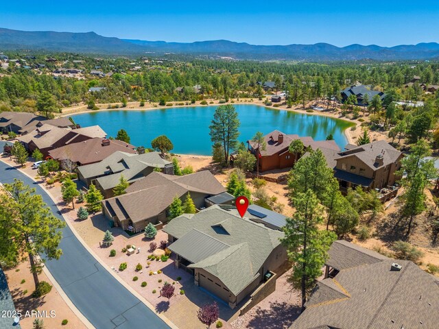 bird's eye view featuring a residential view and a water and mountain view