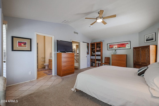 tiled bedroom featuring lofted ceiling, connected bathroom, and ceiling fan