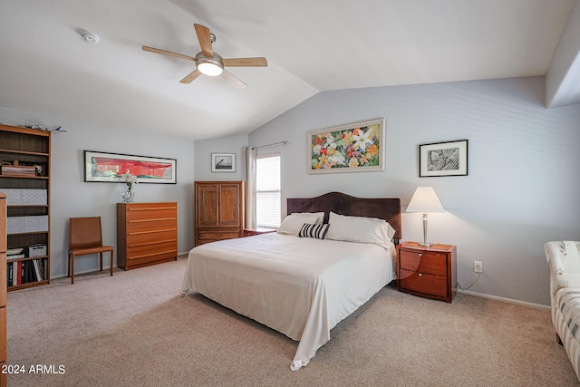 carpeted bedroom with vaulted ceiling and ceiling fan