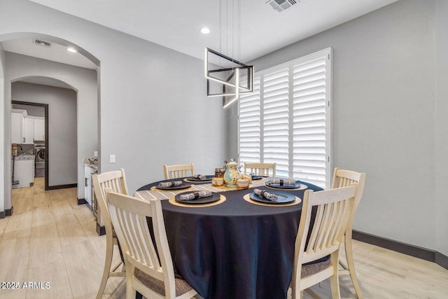 dining space with light hardwood / wood-style floors