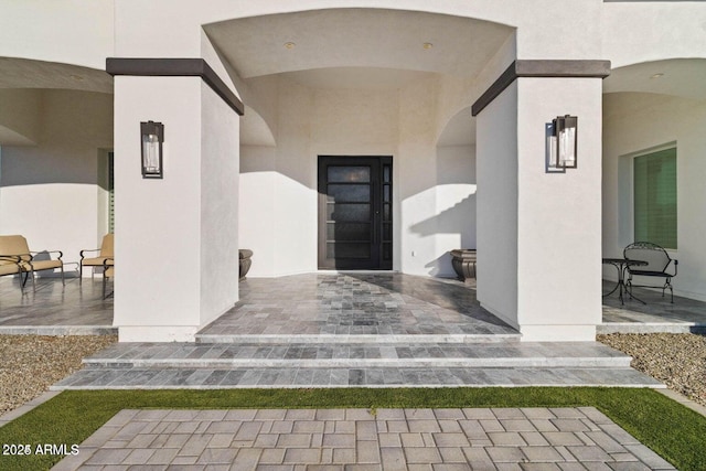 doorway to property with a patio area