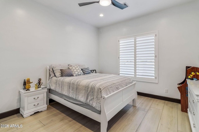 bedroom featuring light wood-type flooring and ceiling fan