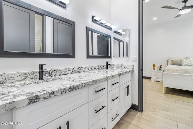 bathroom featuring ceiling fan and vanity