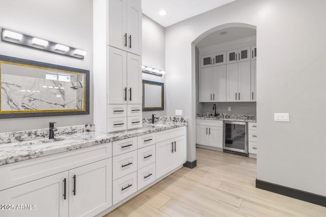 bathroom with vanity and wine cooler