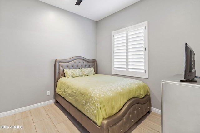 bedroom featuring hardwood / wood-style flooring and ceiling fan