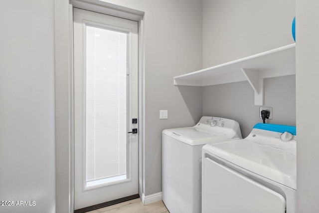 laundry room featuring washing machine and dryer