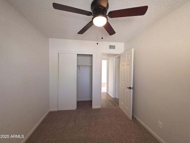 720 S Dobson Rd Unit 24, Mesa, AZ 85202 - unfurnished bedroom featuring ceiling fan, a textured ceiling, a closet, visible vents, and carpet flooring