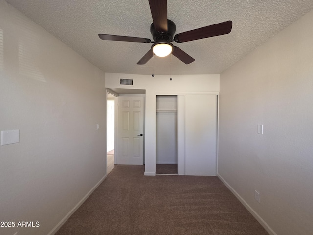 720 S Dobson Rd Unit 24, Mesa, AZ 85202 - unfurnished bedroom featuring visible vents, a closet, carpet flooring, and a textured ceiling