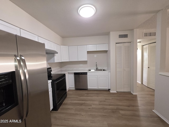 720 S Dobson Rd Unit 24, Mesa, AZ 85202 - kitchen with appliances with stainless steel finishes, a sink, visible vents, and under cabinet range hood