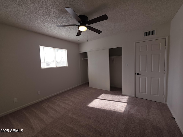 720 S Dobson Rd Unit 24, Mesa, AZ 85202 - unfurnished bedroom featuring a textured ceiling, a closet, visible vents, and carpet floors
