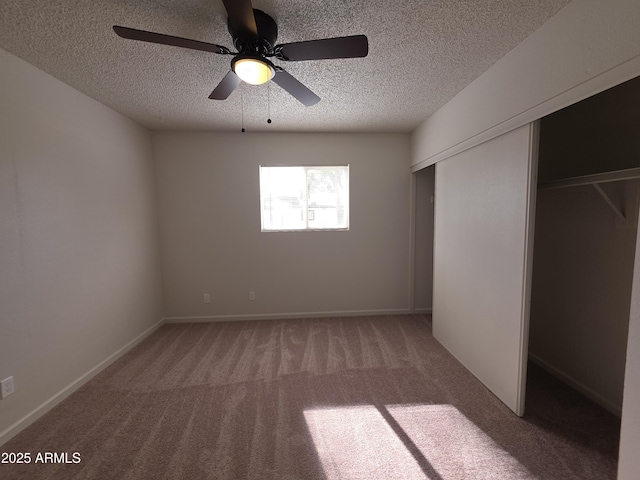 720 S Dobson Rd Unit 24, Mesa, AZ 85202 - unfurnished bedroom featuring a textured ceiling, a closet, and light colored carpet