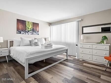 bedroom featuring dark hardwood / wood-style floors