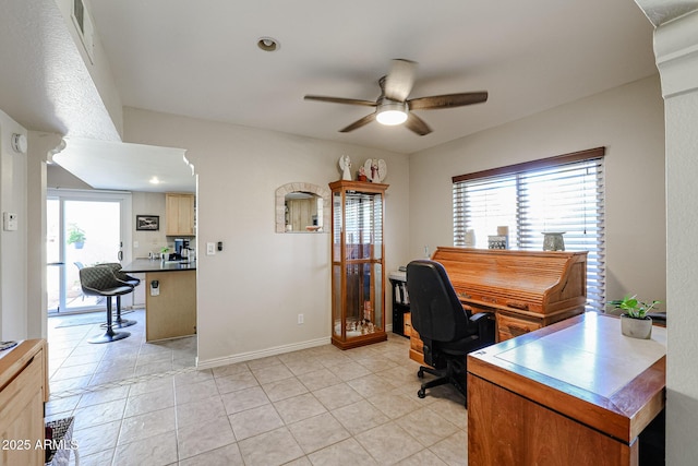 office with ceiling fan, a healthy amount of sunlight, and light tile patterned floors