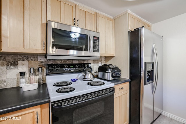 kitchen with backsplash, appliances with stainless steel finishes, and light brown cabinets