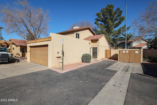 mediterranean / spanish house with a garage