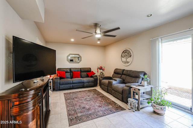 living room with ceiling fan and light tile patterned floors