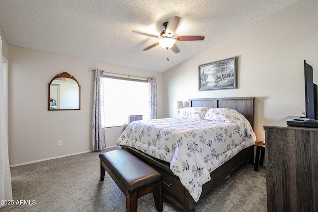 bedroom with vaulted ceiling, ceiling fan, a textured ceiling, and carpet floors