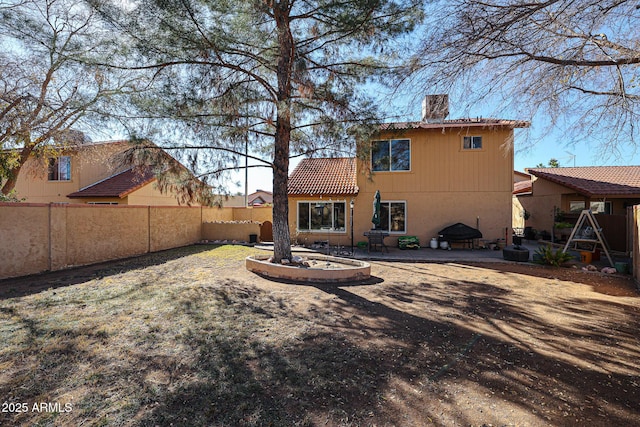 rear view of house with a patio