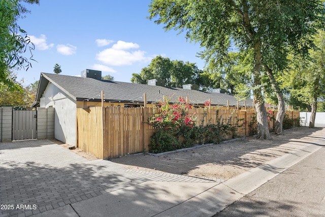 3139 N 40th St, Phoenix, AZ 85018 - view of home's exterior with a gate and a shingled roof