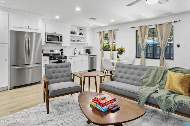 3139 N 40th St, Phoenix, AZ 85018 - living area with light wood finished floors, recessed lighting, and ceiling fan