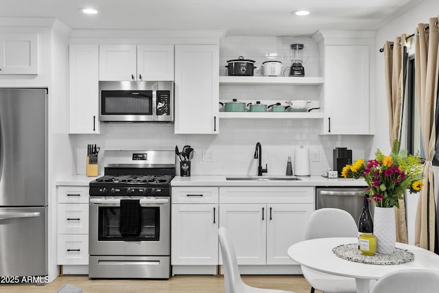 3139 N 40th St, Phoenix, AZ 85018 - kitchen with stainless steel appliances, a sink, light countertops, and recessed lighting