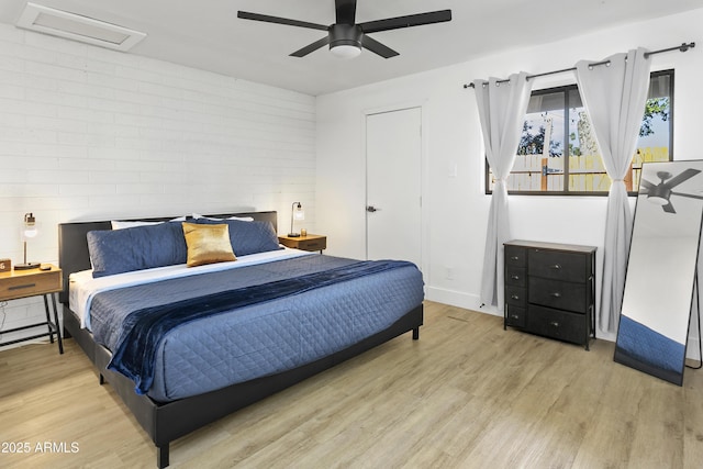 3139 N 40th St, Phoenix, AZ 85018 - bedroom featuring wood finished floors, a ceiling fan, and baseboards