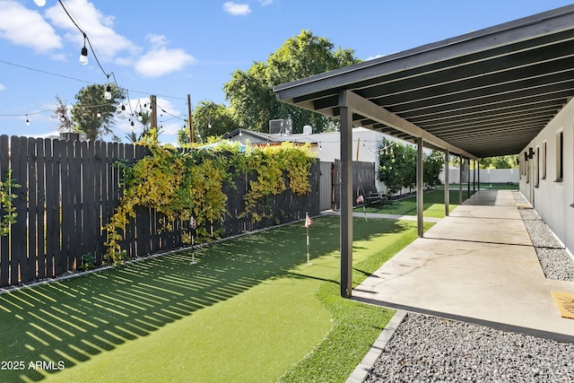 3139 N 40th St, Phoenix, AZ 85018 - fenced backyard featuring a putting area and a patio