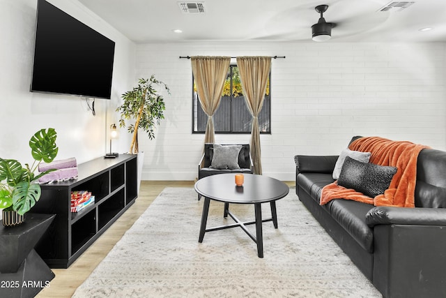 3139 N 40th St, Phoenix, AZ 85018 - living area with light wood-style floors, a ceiling fan, and baseboards