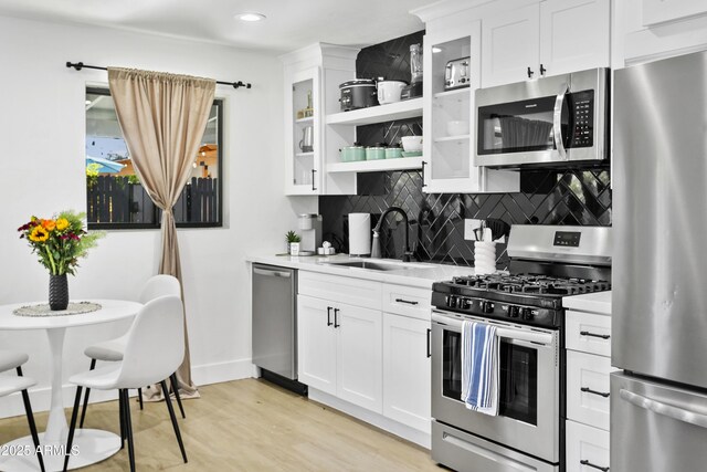 3139 N 40th St, Phoenix, AZ 85018 - kitchen with appliances with stainless steel finishes, a sink, light countertops, tasteful backsplash, and recessed lighting
