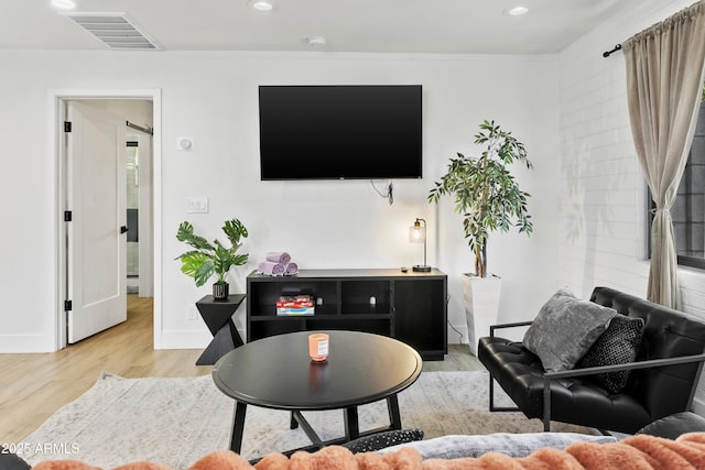 3139 N 40th St, Phoenix, AZ 85018 - living area with light wood finished floors, recessed lighting, and baseboards