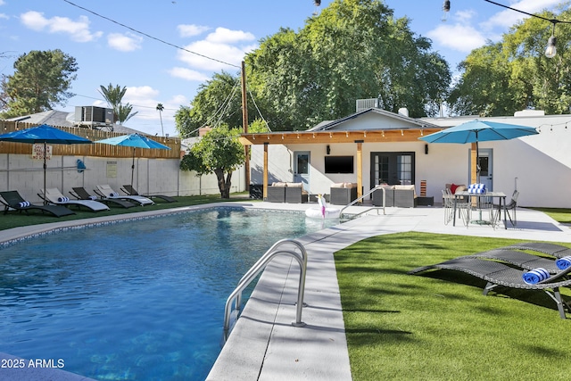 3139 N 40th St, Phoenix, AZ 85018 - swimming pool with an outdoor living space, central air condition unit, a patio, and french doors