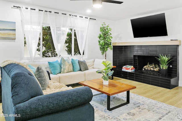 3139 N 40th St, Phoenix, AZ 85018 - living area featuring wood finished floors, a fireplace, and a ceiling fan