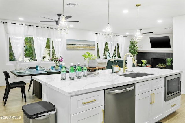 3139 N 40th St, Phoenix, AZ 85018 - kitchen with appliances with stainless steel finishes, ceiling fan, a sink, open floor plan, and recessed lighting