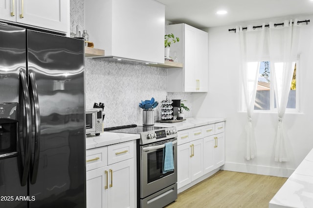 3139 N 40th St, Phoenix, AZ 85018 - kitchen featuring appliances with stainless steel finishes, light stone counters, white cabinets, and recessed lighting