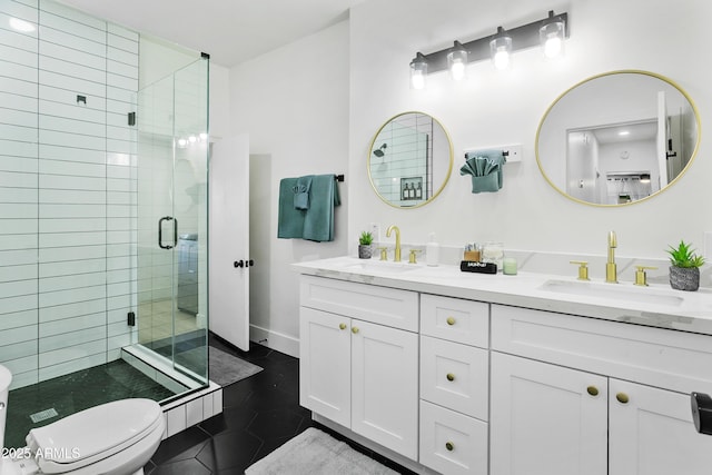 3139 N 40th St, Phoenix, AZ 85018 - full bath with double vanity, a shower stall, tile patterned flooring, toilet, and baseboards