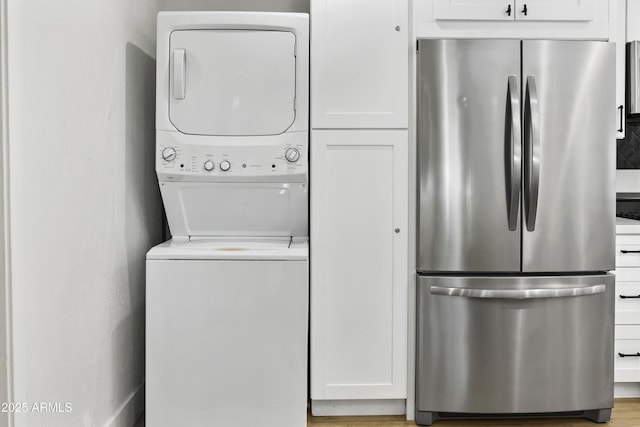 3139 N 40th St, Phoenix, AZ 85018 - washroom featuring estacked washer and dryer