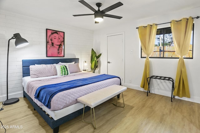 3139 N 40th St, Phoenix, AZ 85018 - bedroom featuring wood finished floors, baseboards, and ceiling fan