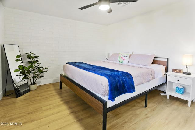 3139 N 40th St, Phoenix, AZ 85018 - bedroom with light wood-style floors and a ceiling fan