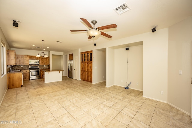 40808 N Raleigh Ct, Anthem, AZ 85086 - unfurnished living room featuring ceiling fan, baseboards, light tile patterned floors, and recessed lighting