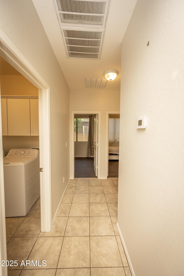 40808 N Raleigh Ct, Anthem, AZ 85086 - hall featuring washer / clothes dryer and light tile patterned floors