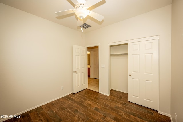 40808 N Raleigh Ct, Anthem, AZ 85086 - unfurnished bedroom featuring dark wood-style flooring, a closet, and baseboards