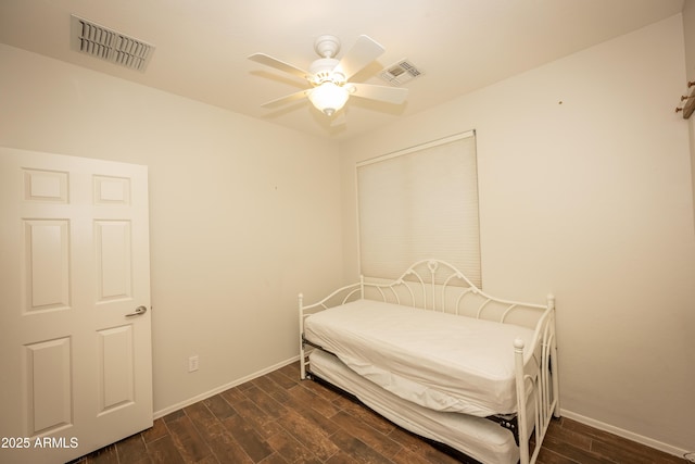 40808 N Raleigh Ct, Anthem, AZ 85086 - bedroom with dark wood finished floors, baseboards, and ceiling fan