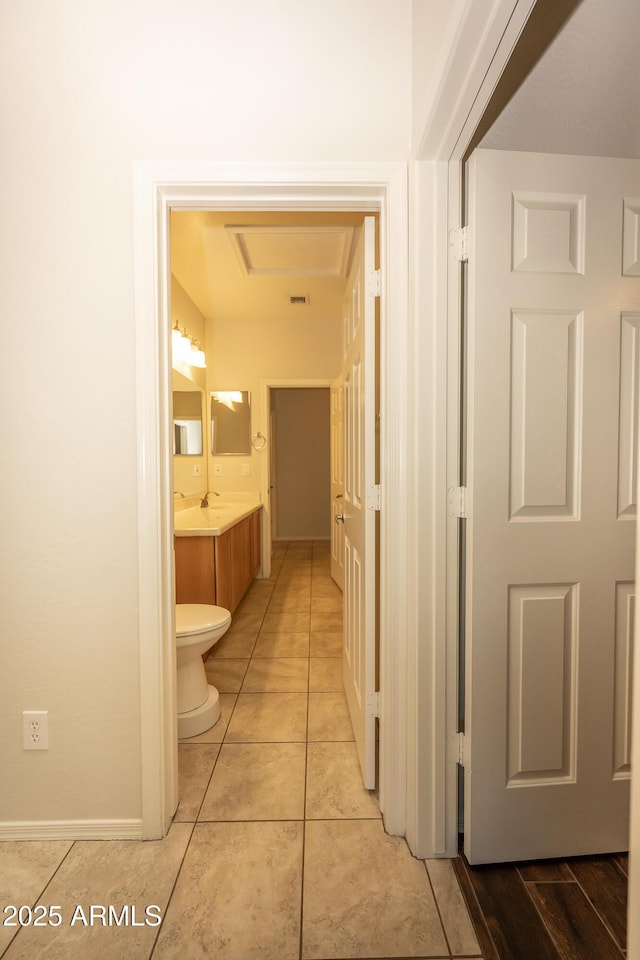 40808 N Raleigh Ct, Anthem, AZ 85086 - hallway featuring baseboards and light tile patterned floors