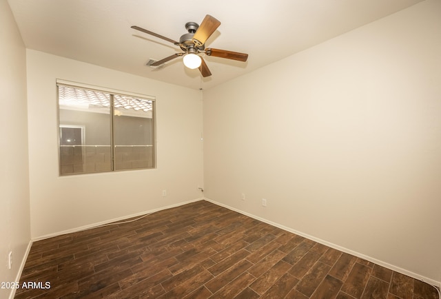 40808 N Raleigh Ct, Anthem, AZ 85086 - unfurnished room featuring dark wood-style floors, baseboards, and ceiling fan