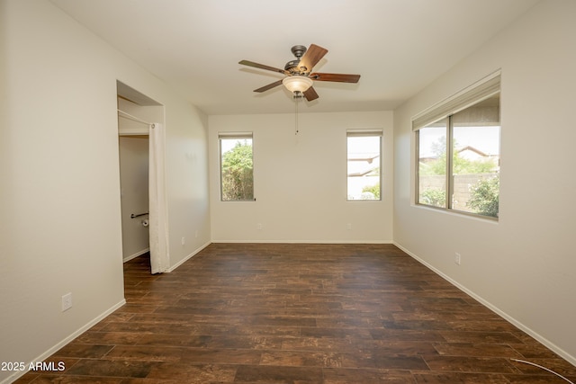 40808 N Raleigh Ct, Anthem, AZ 85086 - unfurnished room featuring a ceiling fan, dark wood-type flooring, and baseboards