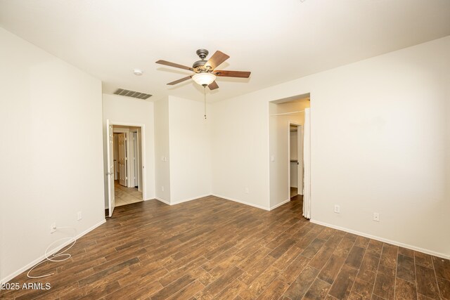 40808 N Raleigh Ct, Anthem, AZ 85086 - empty room featuring ceiling fan, dark wood-type flooring, and baseboards