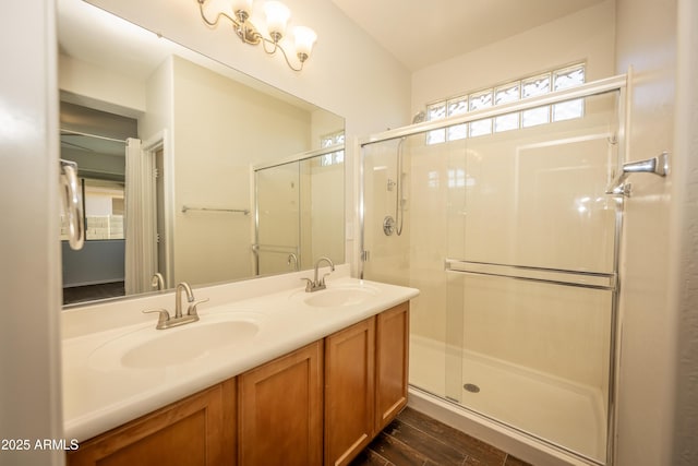 40808 N Raleigh Ct, Anthem, AZ 85086 - full bathroom with a stall shower, double vanity, and wood finished floors