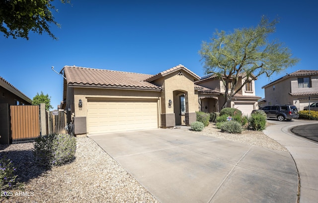 40808 N Raleigh Ct, Anthem, AZ 85086 - mediterranean / spanish home with stucco siding, a tile roof, a garage, and concrete driveway