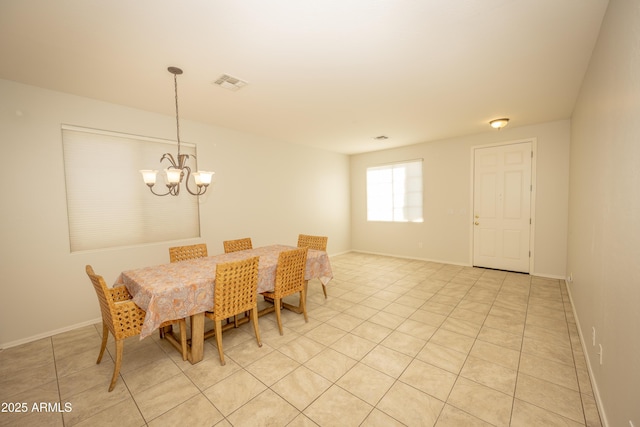 40808 N Raleigh Ct, Anthem, AZ 85086 - dining area featuring a chandelier, light tile patterned floors, and baseboards